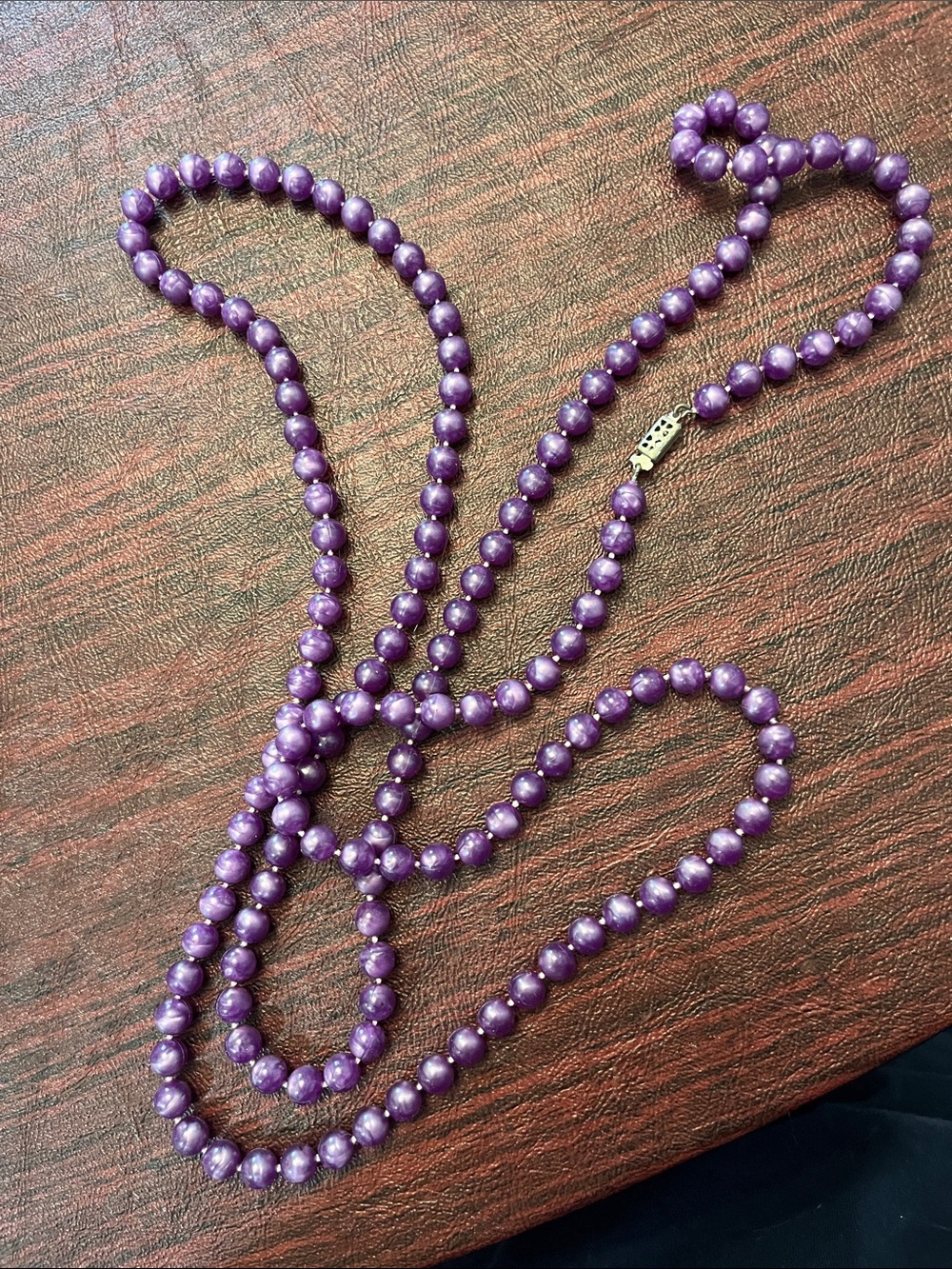 Vintage purple plastic beaded 27” necklace.